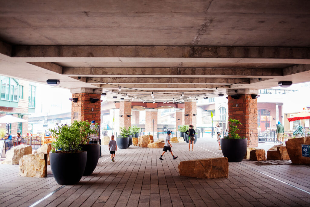 photogenic outdoor mall below overpass